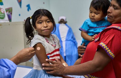 Siblings get vaccinated in las Garzas Health Center in Panama