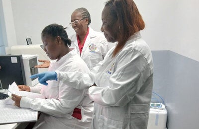 Assessment team in Grenada's laboratory