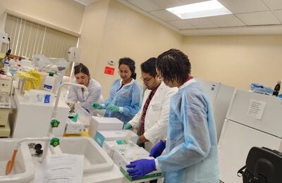 Lab technicians in the UWI Lab