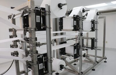 Linea de mascarillas instalada en COMBIOMED como parte de proyecto con UE y OPS