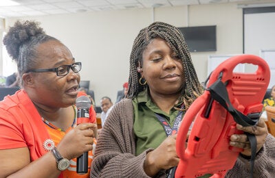Health care workers role play in communications for vaccine uptake training