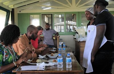 winning team presenting their meal to the judges
