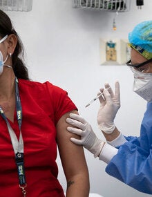 Health worker gets vaccinated 