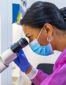 Woman using a microscope