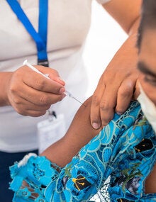 WOman is vaccinated against COVID-19 in Guatemala