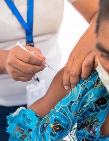 WOman is vaccinated against COVID-19 in Guatemala