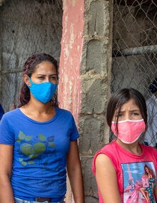 People walking wearing masks