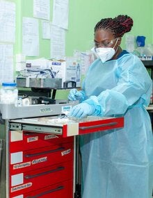 Nurse Samanta Toney working in the COVID-19 Intensive Care Unit in 's Lands Hospital in Suriname.