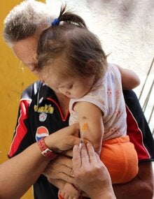 girl receiving measles