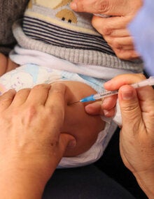 Young child receives vaccines