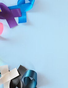 colorful cancer awareness ribbons on blue background