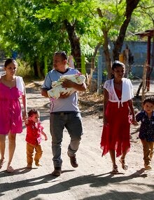 family walking down a dirt road