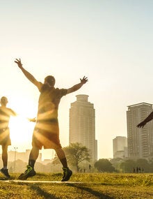 Group of people exercising in open space