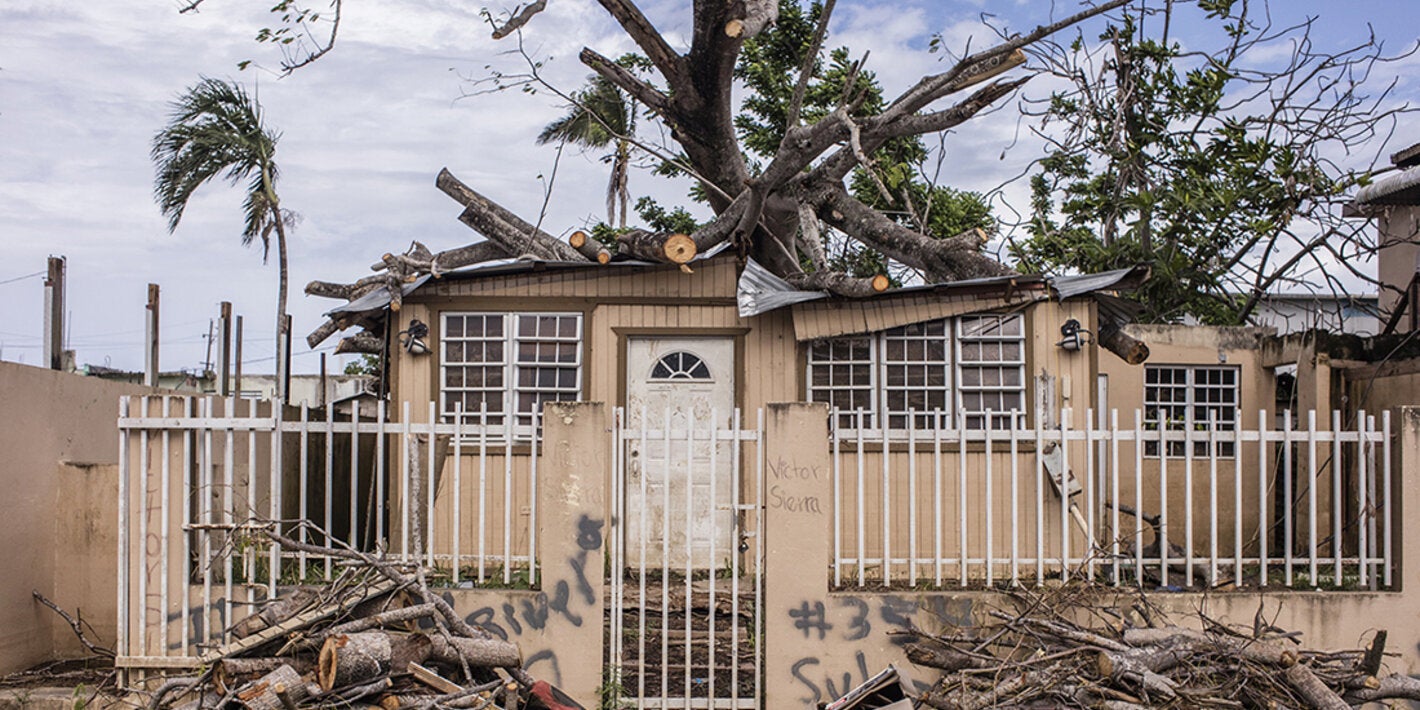 Debris outside house after storm in Puerto Rico