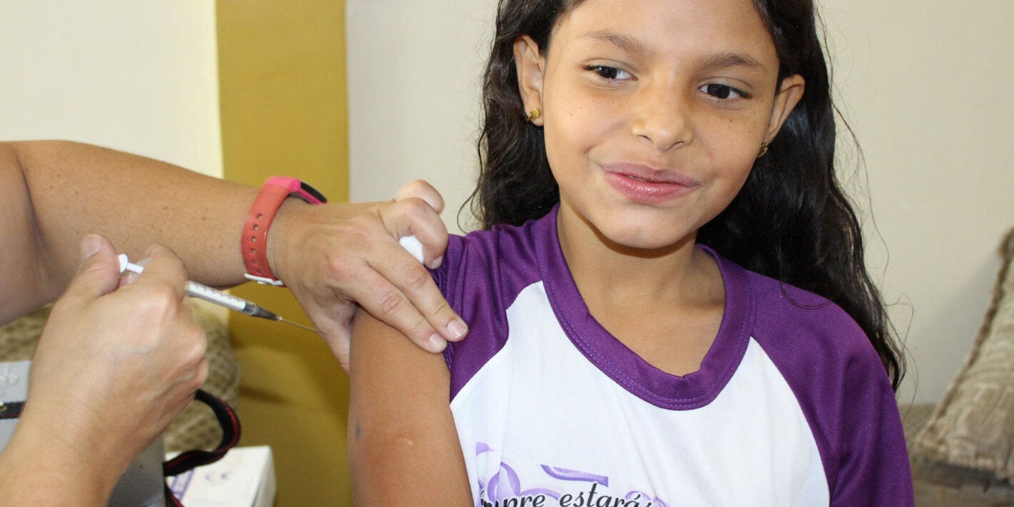Girl being vaccinated