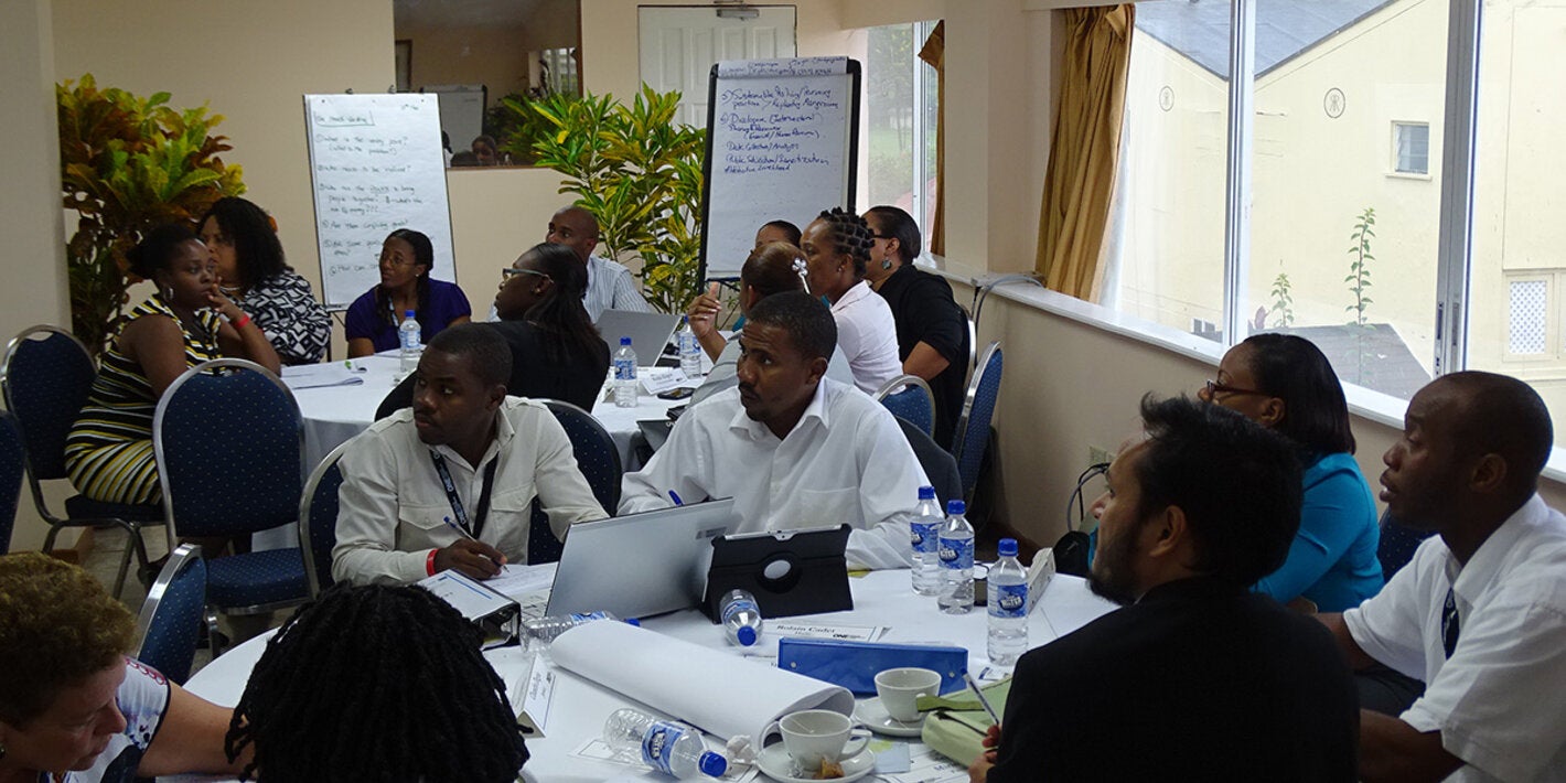 Caribbean participants work in groups.