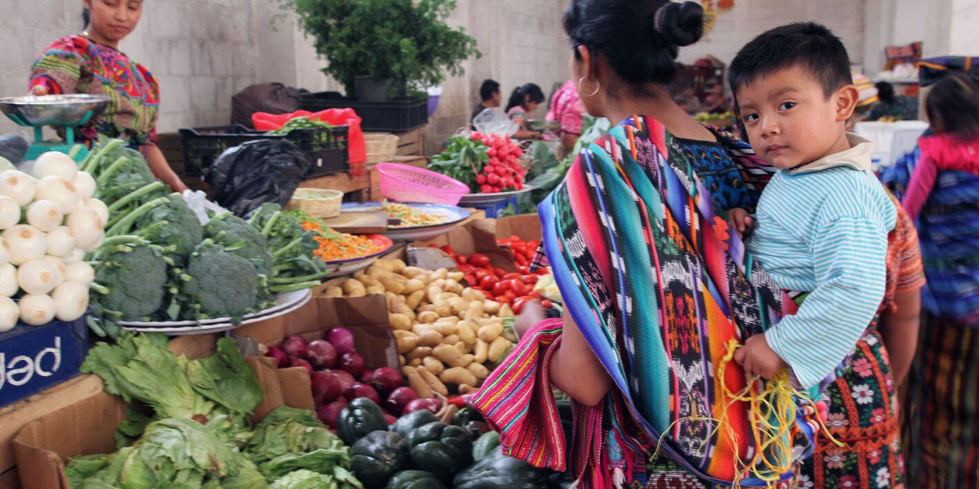 Indigenous moher and child in market