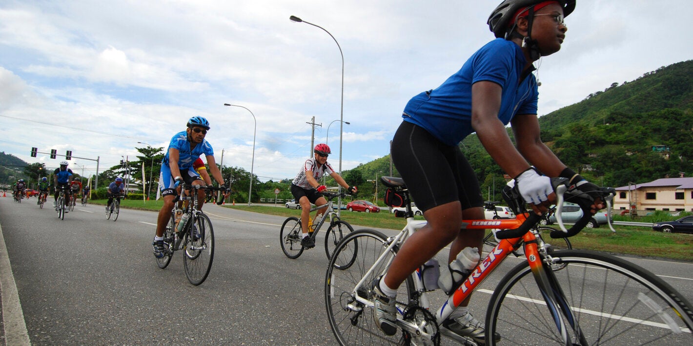 People riding bicycles on a road