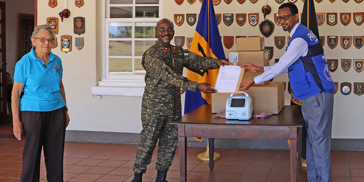 Dr Yitades Gebre presenting ventilator to BDF