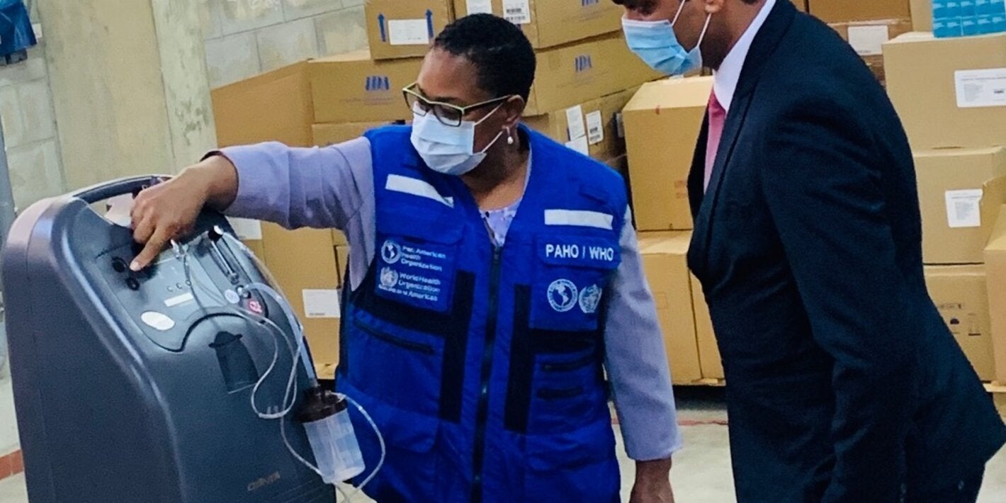 PAHO/WHO Representative for Suriname, Dr. Karen Lewis-Bell officially hands-over 20 oxygen concentrators to Dr. Amar Ramadhin, Minister of Health.