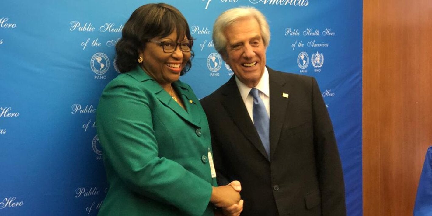 Carissa F. Etienne congratulates former Uruguayan President Tabaré Vázquez