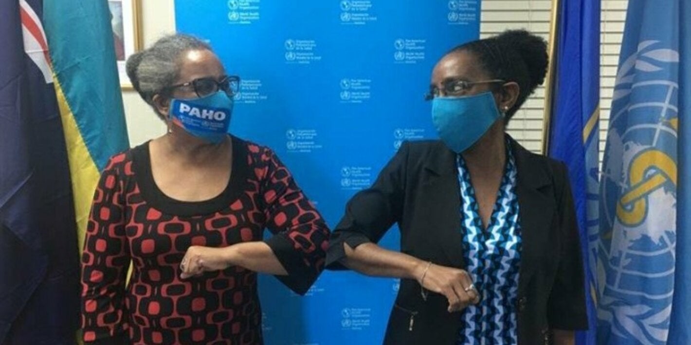 Dr Esther de Gourville, outgoing Country Representative and Dr. Eldonna Boisson, Incoming Country Representative during a friendly conversation.