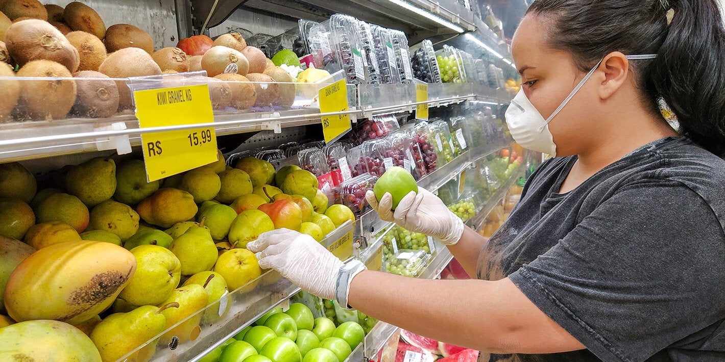 Woman buying fruit in a supermarket