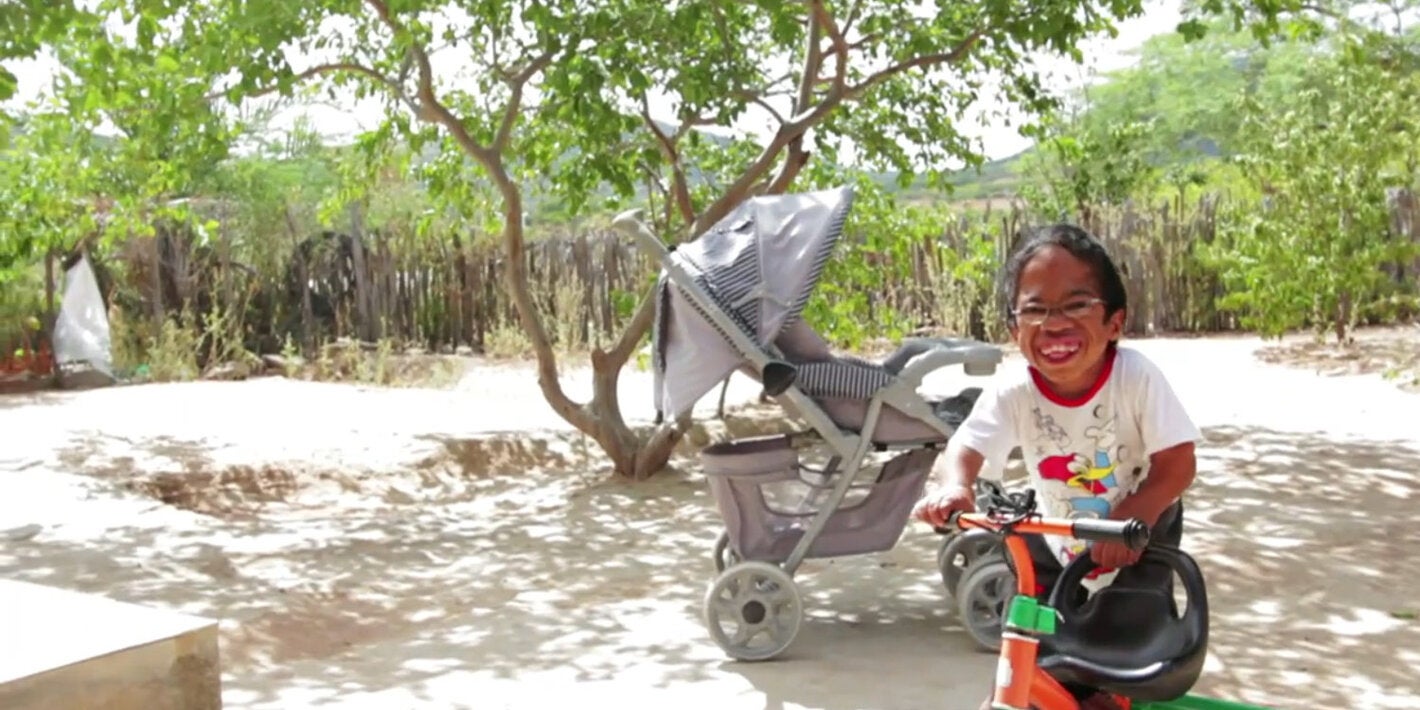 Happy child playing in courtyard