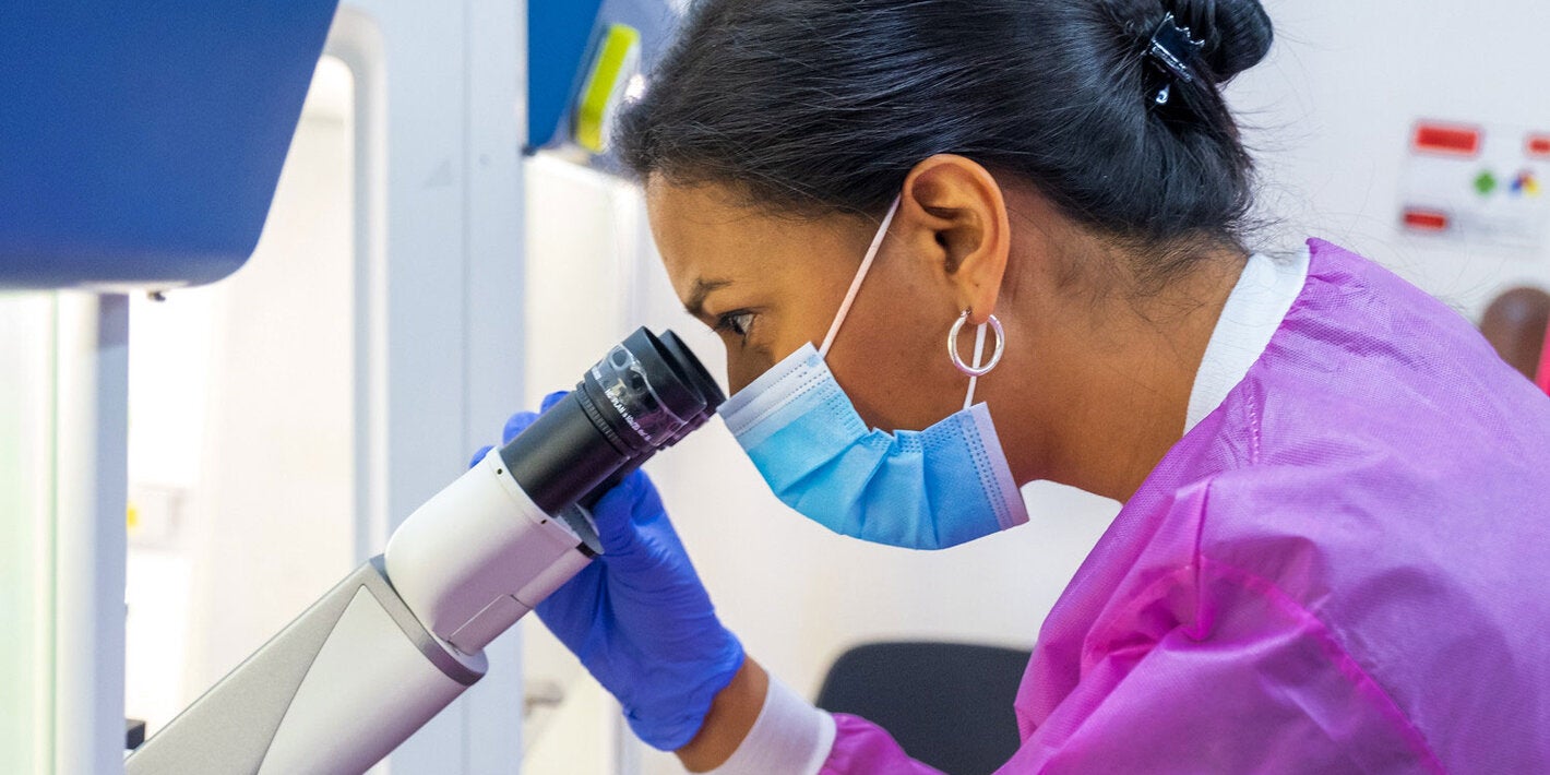 Woman using a microscope
