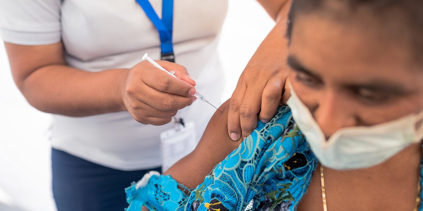 WOman is vaccinated against COVID-19 in Guatemala