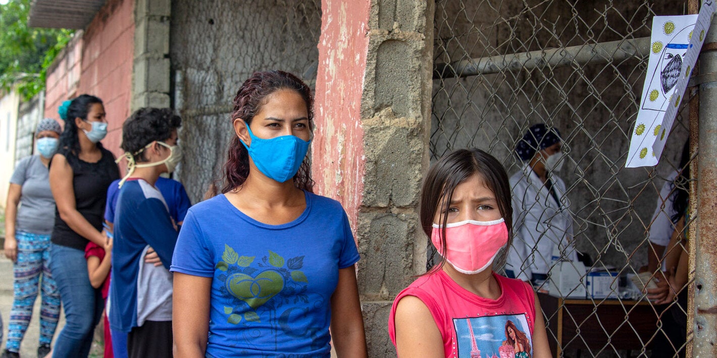 People walking wearing masks