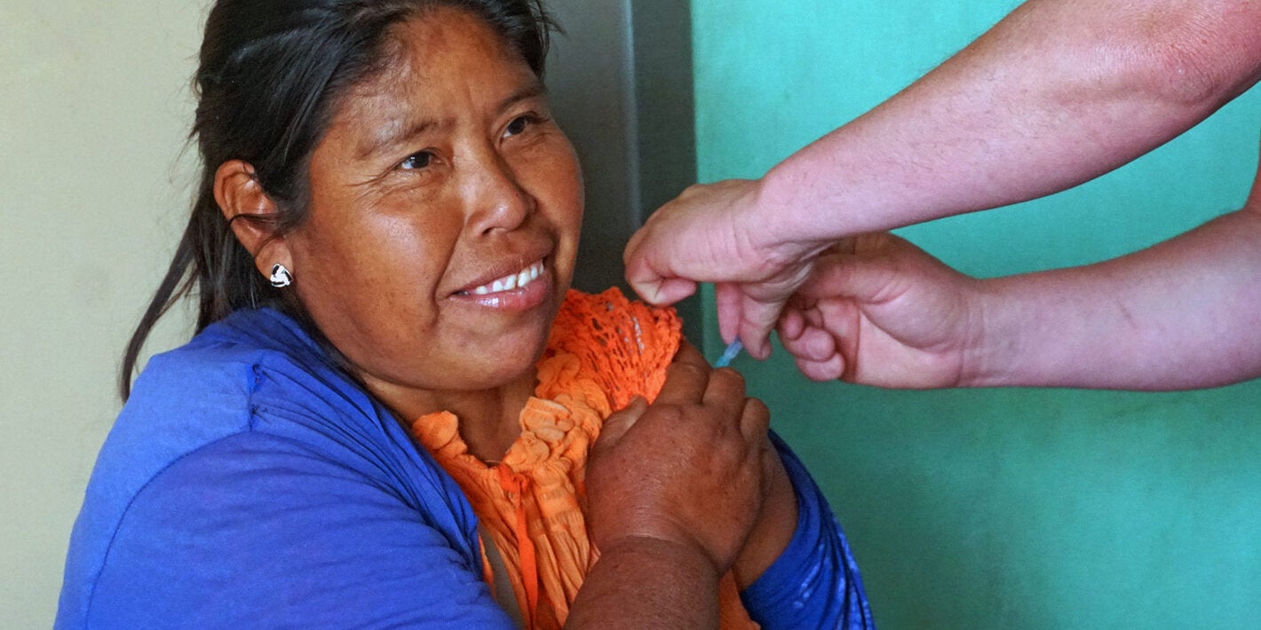 Indigenous woman is vaccianted against COVID-19