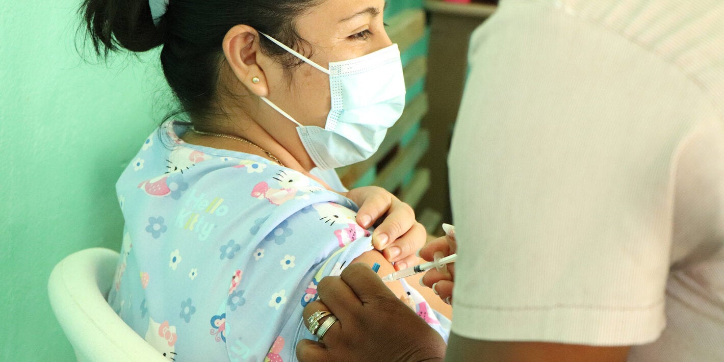 Young woman receives COVID-19 vaccination