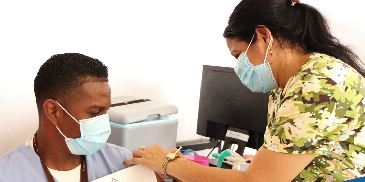 Man receives COVID-19 vaccination