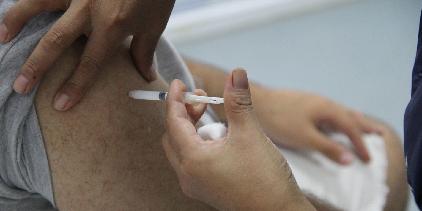 Man gets COVID-19 vaccine