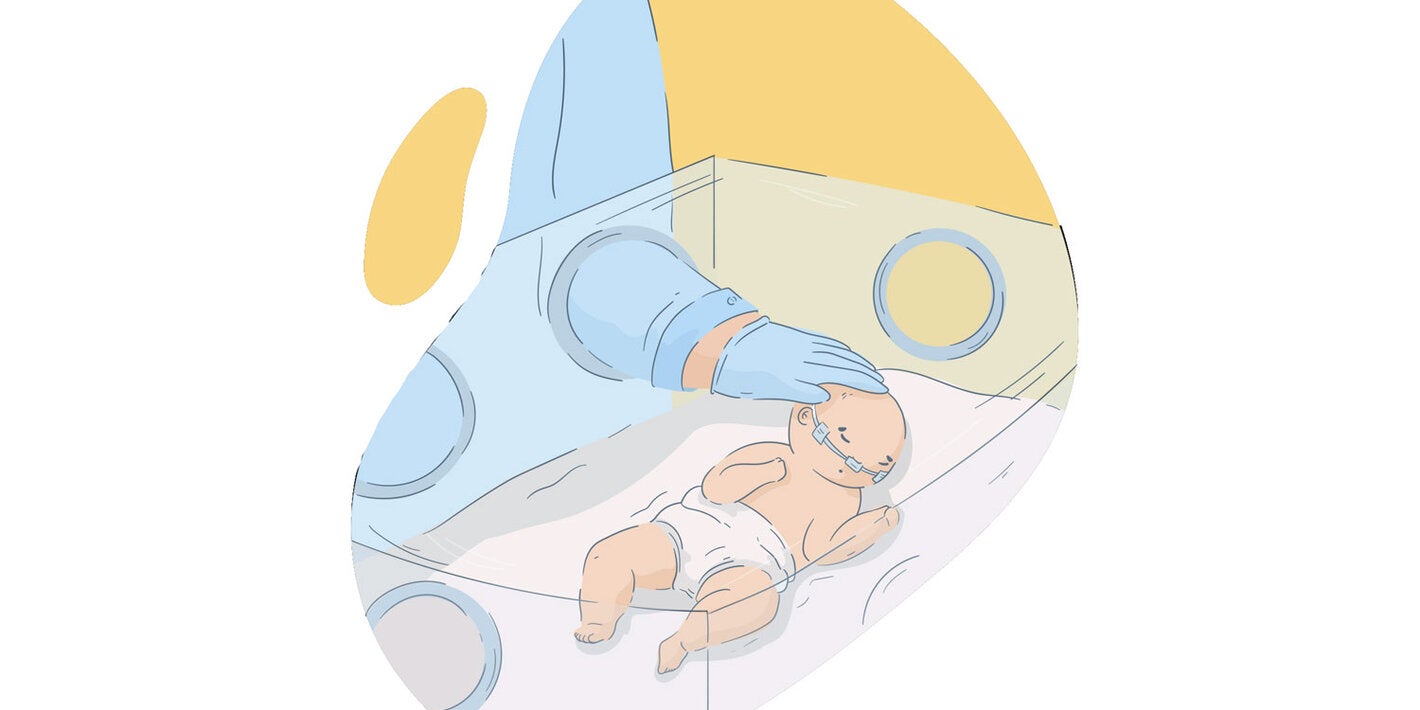 Newborn in incubator