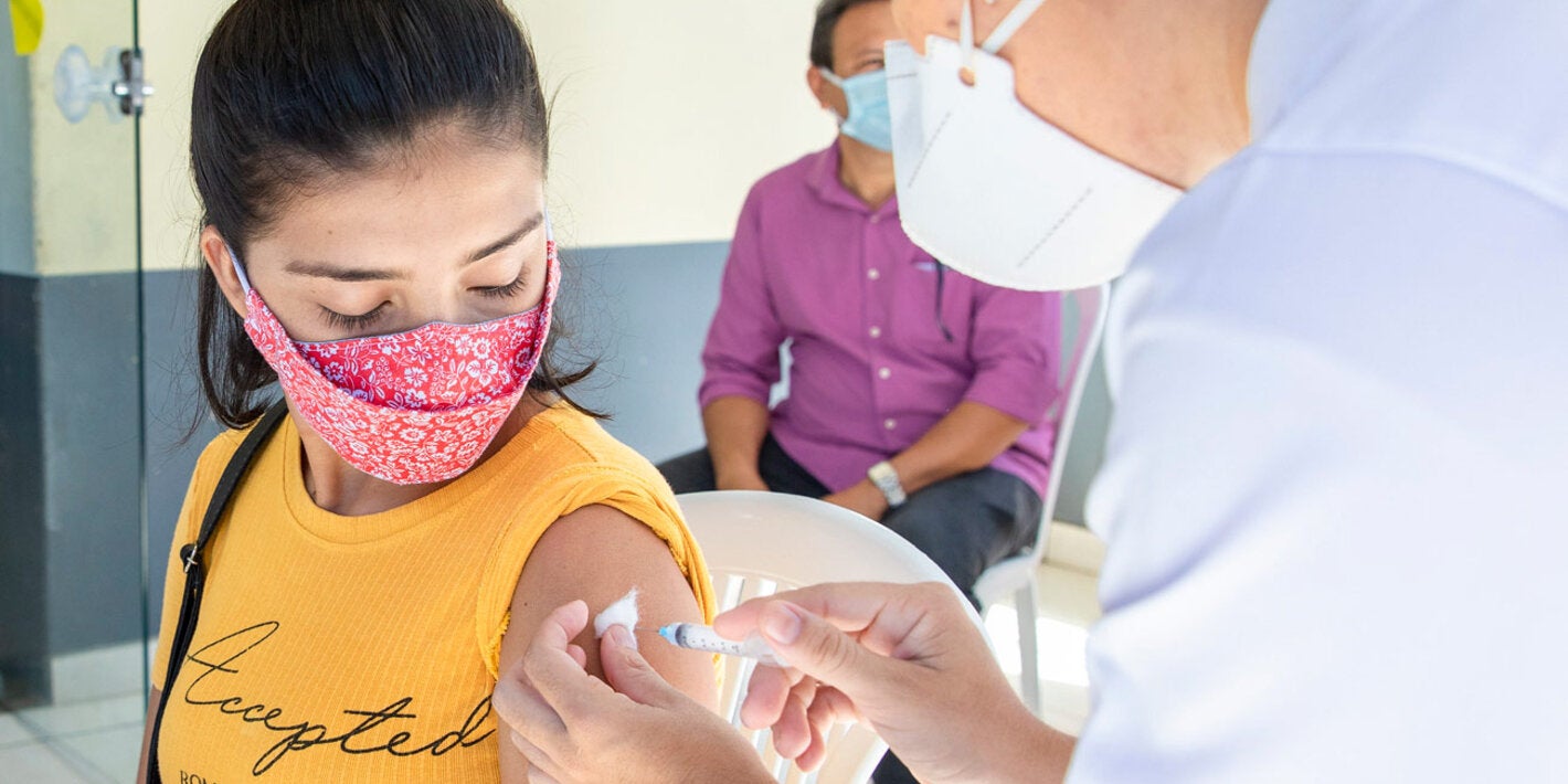 Young woman gets COVID-19 vaccine