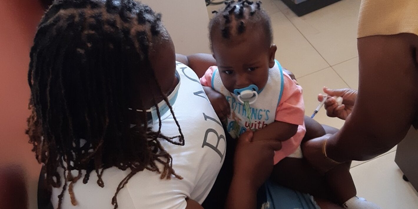 Baby gets immunized at the Kitson Town Health Centre