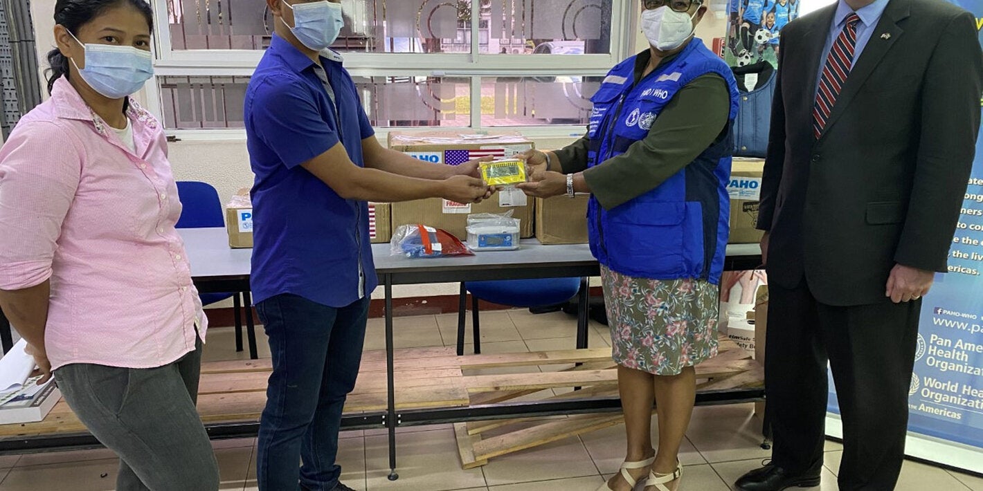 Cold Chain Coordinator Celine Karijo, Drs. Djamiel Koesni- EPI Manager BOG, PAHO Representative Dr. Karen Lewis-Bell, and USA Deputy Chief of Mission Michael Keays