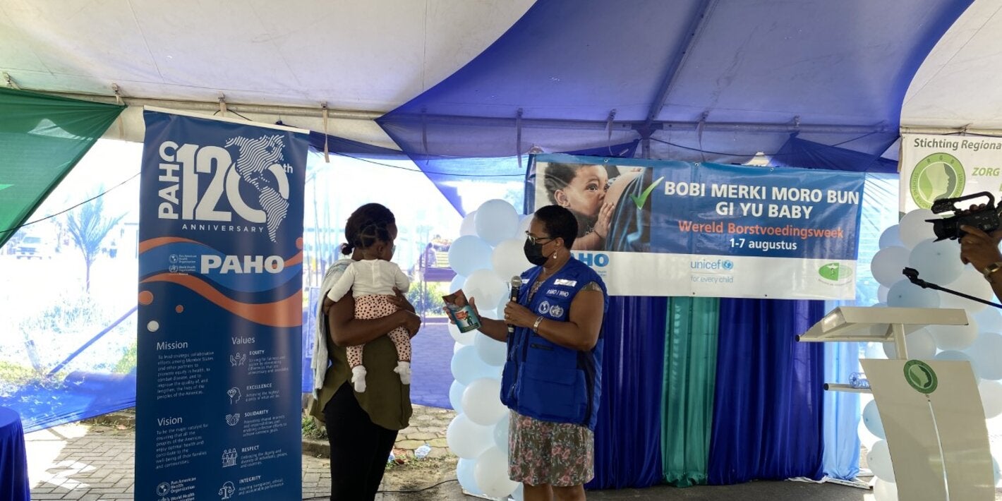 Informative breastfeeding brochure handover by PAHO Representative Dr. Karen Lewis-Bell during the opening of the Breastfeeding Week 2022 in Suriname 
