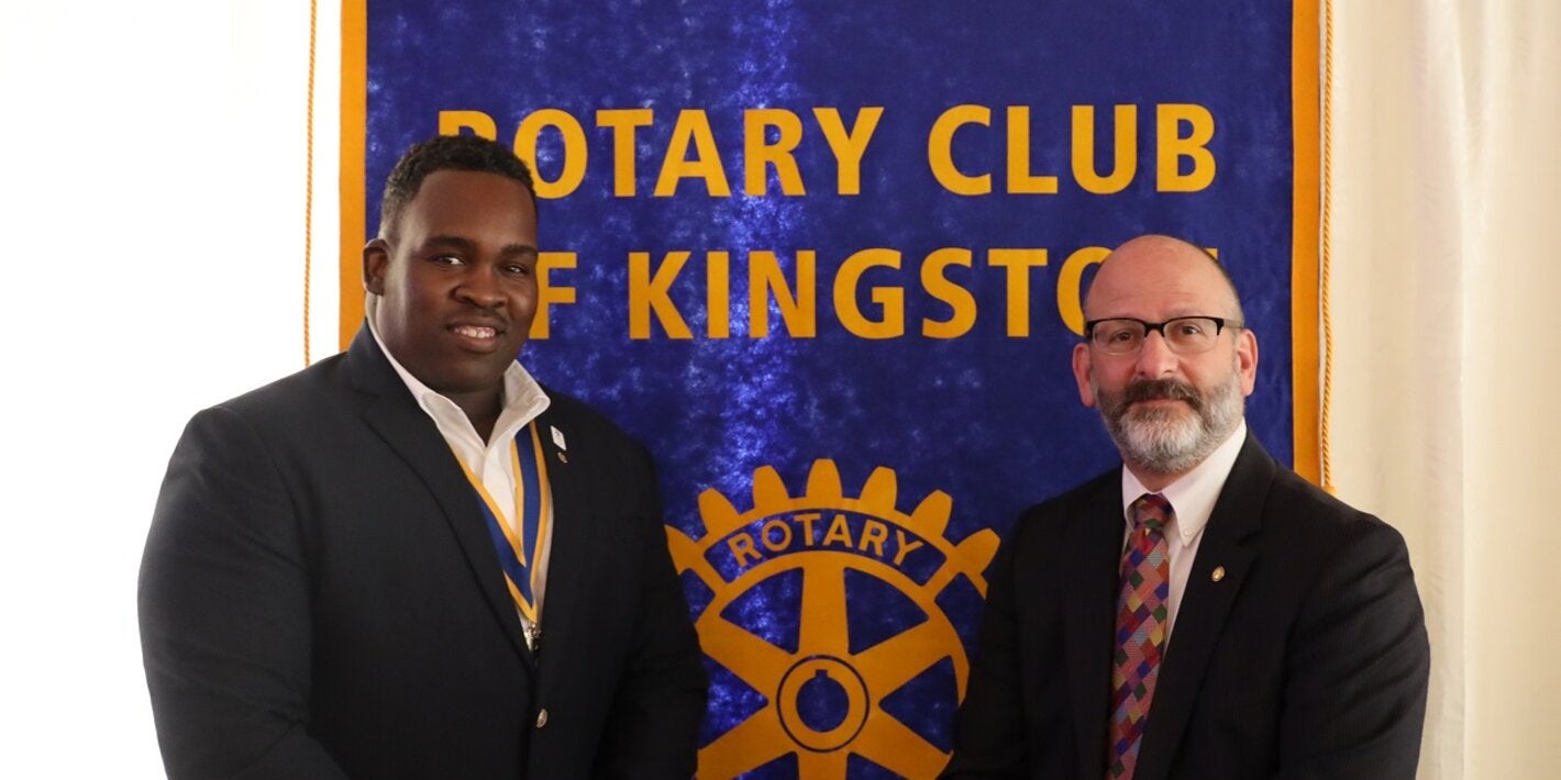 Mr. Ian Stein, Pan American Health Organization/ World Health Organization Representative to Jamaica, Bermuda and the Cayman Islands (right) paused to greet Karsten Johnson, President of the Rotary Club of Kingston after his lunchtime presentation on polio and NCDs
