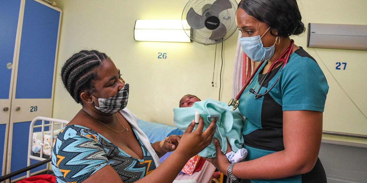 Mother with child receiving medical care