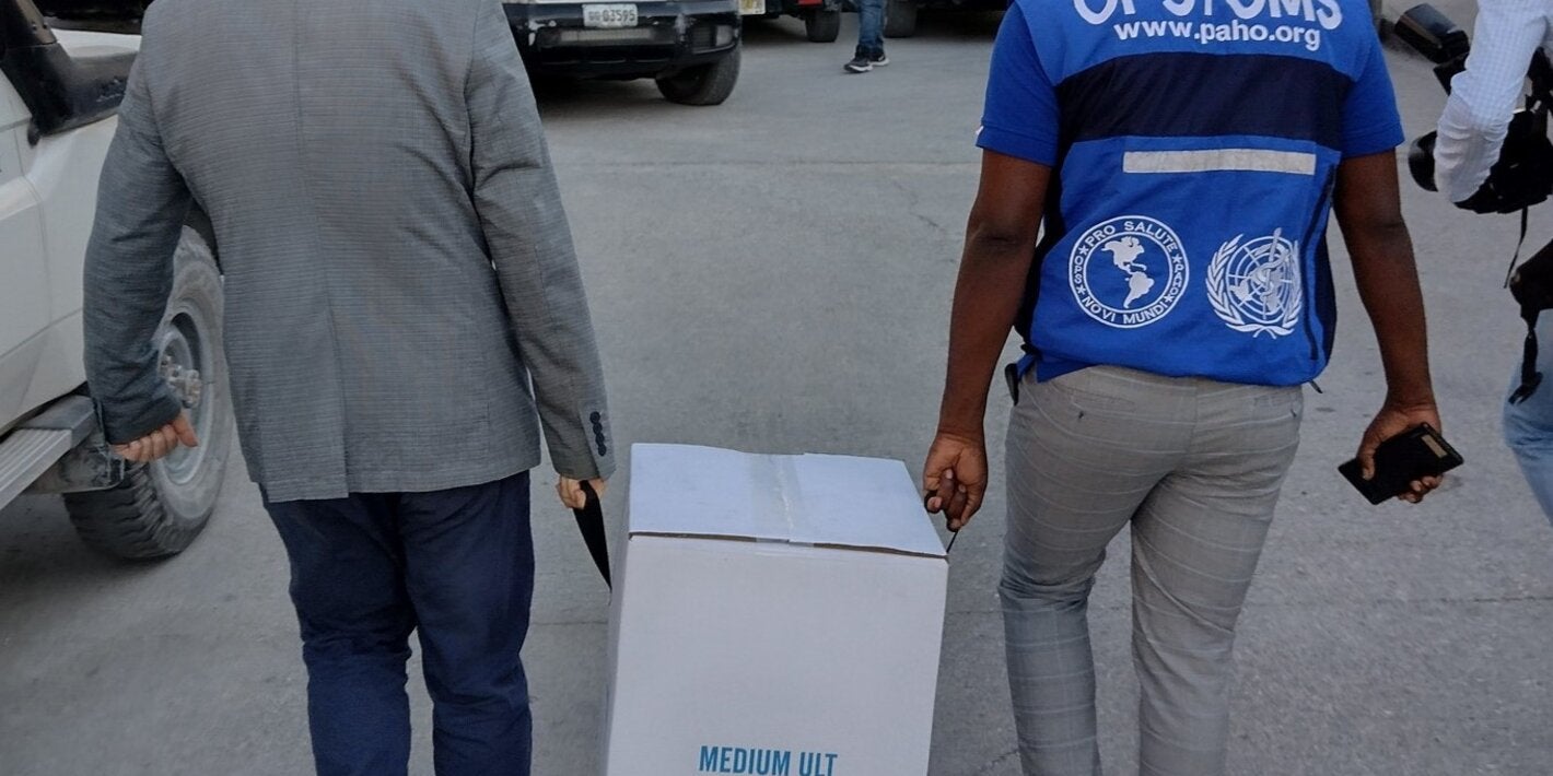 man carries box with supplies