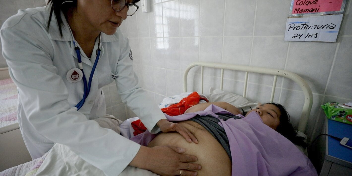Pregnant woman receiving medical attention