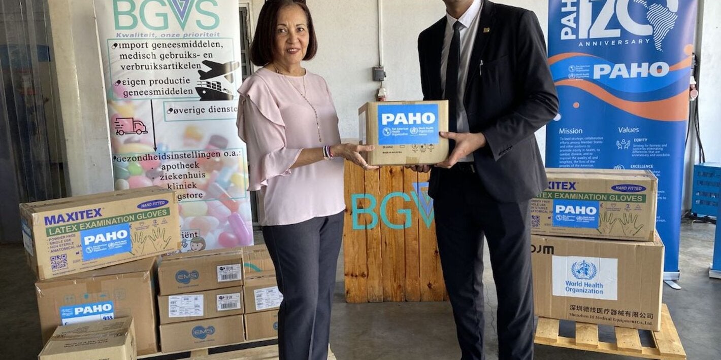 PAHO/WHO Representative Suriname Dr. Lilian Reneau-Vernon, and Minister of Health Dr. Amar Ramadhin during the handover of medical equipment and supplies 
