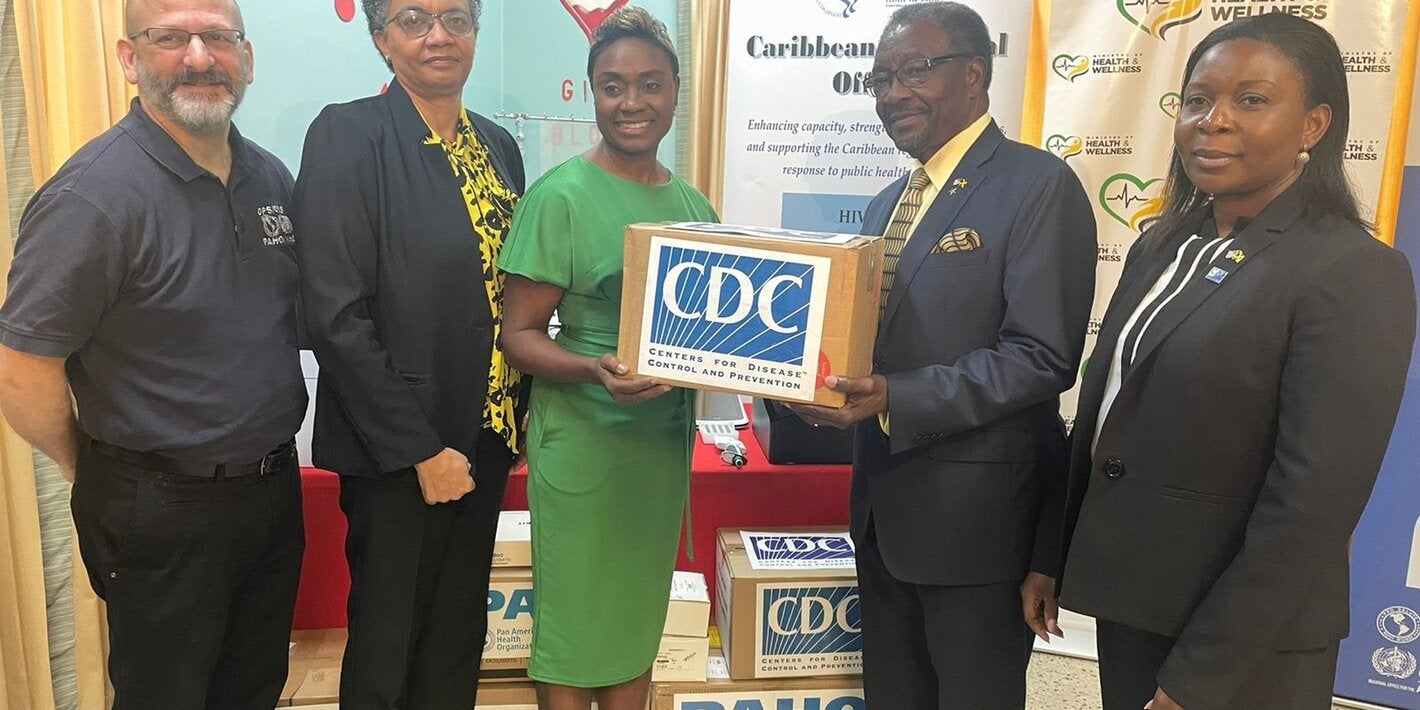 U.S. Ambassador Nick Perry (2nd right) pictured with Hon. Julieth Cuthbert-Flynn, Minister of State, Ministry of Health and Wellness (3rd left) while (L-R) Mr. Ian Stein, Pan American Health Organization/ World Health Organization Representative to Jamaica, Dr. Marlene Tapper, Director of the National Laboratory Services and Dr. Emily Kainne Dokubo, Country Director, U.S. Centres for Disease Control & Prevention look on. 
