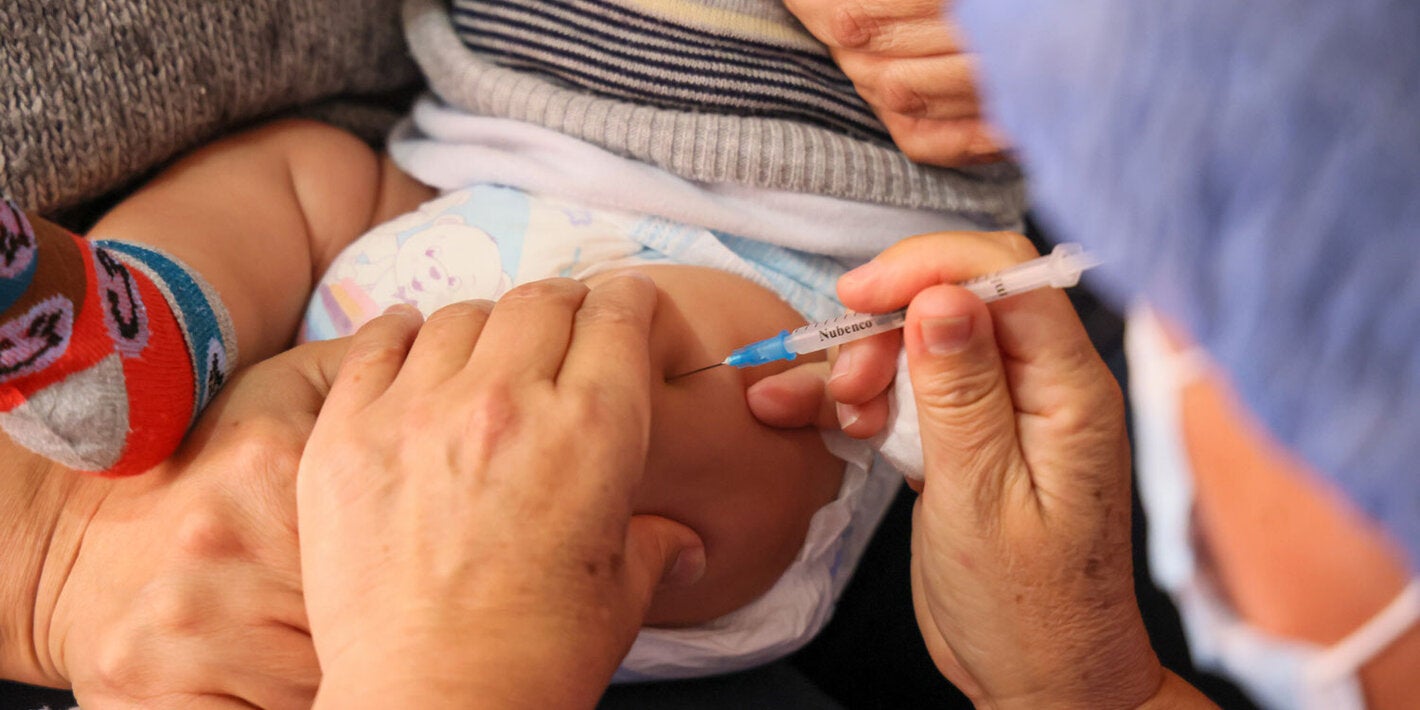 Young child receives vaccines