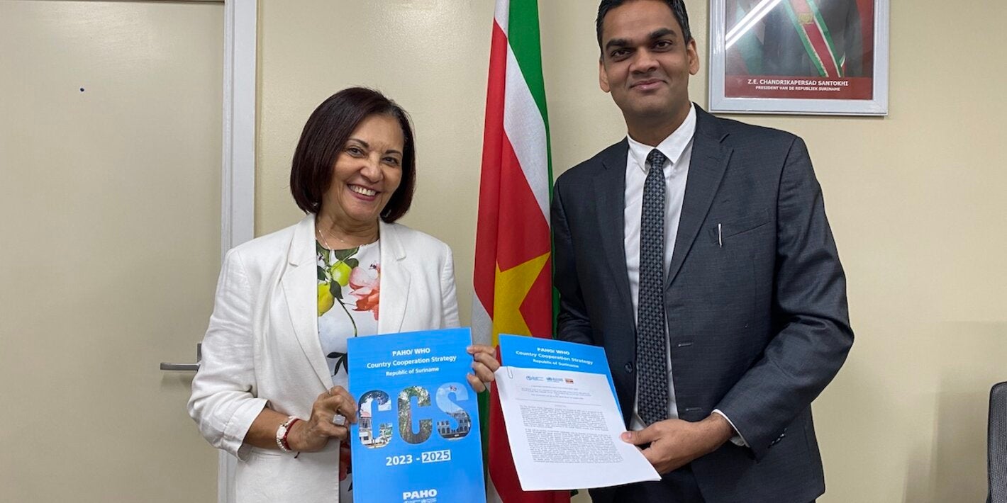 PAHO/WHO Representative Suriname Dr. Lilian Reneau-Vernon & Minister of Health Dr. Amar Ramadhin during the signing