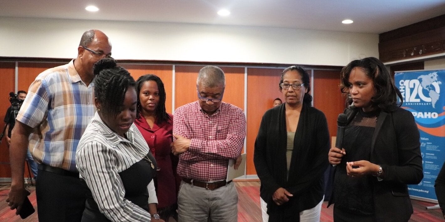 PAHO/WHO Suriname Technical Officer Dr. Wendy Emanuelson-Telgt engaging with several participants during the 2-day workshop