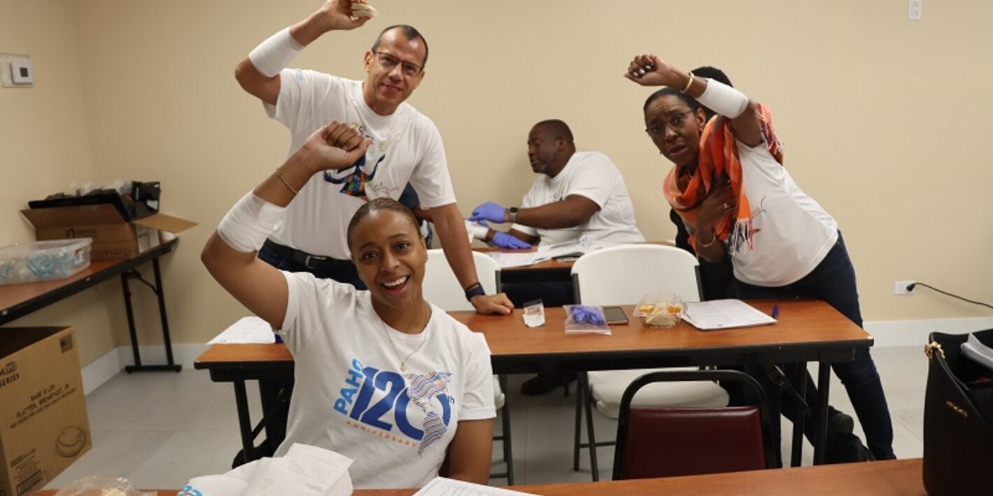 PAHO/WHO team posing with bandages they created.
